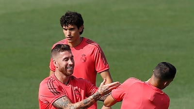 Sergio Ramos, left, jokes around with Lucas Vazquez during a training session. AP Photo
