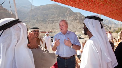David Neild (centre) speaks with Emirati men at a reunion for British expatriates in Ras Al Khaimah in February 2013. Jaime Puebla / The National