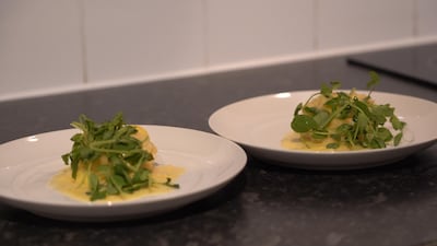 Lasagne of Dorset crab with buerre Nantais and pea shoots.