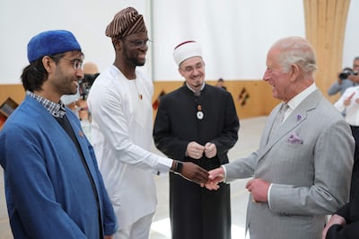 King Charles meets faith leaders and community members. AFP