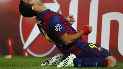 Barcelona's Luis Suarez celebrates his goal, his first for the club and Barca's third on Wednesday night, in their 3-1 win over PSG in the Champions League. Quique Garcia / AFP