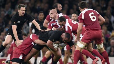 New Zealand's Charlie Faumuina is tackled by Georgia players during their Pool C match on Friday at the 2015 Rugby World Cup. Damien Meyer / AFP / October 2, 2015