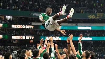 Mexico's players celebrate after winning the match against Ecuador in Mexico City. AFP