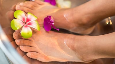 Recreate a spa experience at home with a fragrant foot bath. Unsplash