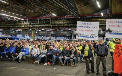 Ford workers facing job cuts put on a show of defiance when Chancellor Olaf Scholz visited a plant in Cologne. AFP