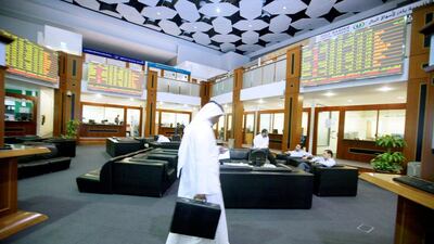 The Dubai Financial Market at the close of the day. Foreign investors bought $718.9 million worth of UAE shares in the first 11 months of the year, up from $202.97m in the same period last year. Randi Sokoloff / The National