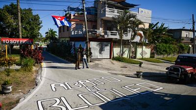 A sign written on the pavement in Santa Clara reads: 'Down with the blockade.' AFP
