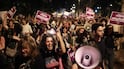 Israeli left-wing activists hold placards and chant slogans during a demonstration in Tel Aviv calling for a formation of a government with Arab parties. AFP