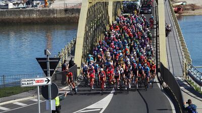 The peloton crosses a bridge during Stage 10 of the Vuelta a Espana, 185km from Castro Urdiales to Suances, on Friday, October 30. EPA