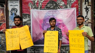 Student activists from Nationalists of Jadavpur University hold placards in solidarity with Israel, at Jadavpur University in Kolkata, India. AP