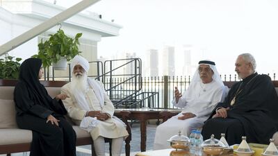 Zaki Nusseibeh (2nd R) and Mariam Al Mehairi, chief executive of TwoFour54 (L), speak with delegates from The Interfaith Alliance for Safer Communities Forum, during a Sea Palace barza. Rashed Al Mansoori / Ministry of Presidential Affairs