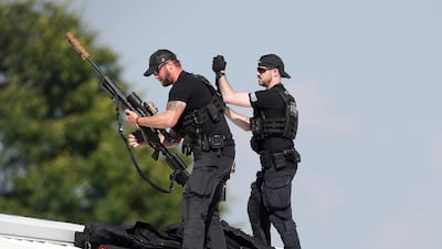 A law enforcement sniper team prepares for the arrival of former president Donald Trump on a rooftop overlooking a campaign rally in Butler, Pennsylvania. EPA