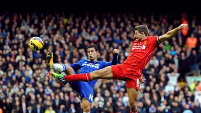 Chelsea's Eden Hazard, left, vies for the ball with Liverpool's Steven Gerrard during their English Premier League match at Anfield in Liverpool, England, on November 8, 2014. Peter Powell / EPA