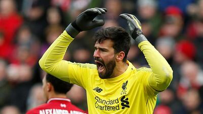Liverpool goalkeeper Alisson reacts after conceding their first goal. Reuters
