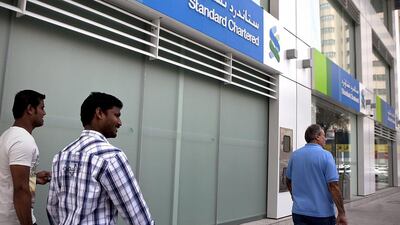 The bank, which has been facing pressure from declining oil prices, said in November that it cut 150 jobs in the UAE. Silvia Razgova / The National