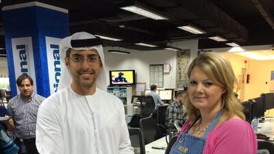 Editor-in-chief, Mohammed Al Otaiba presents winner food writer Stacie Overton Johnson with a rolling pin and apron.