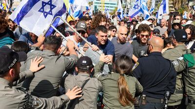 Protesters fight with Israeli security forces during a demonstration against a controversial justice reform bill, in Tel Aviv. AFP