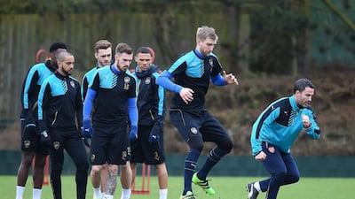 epa05175103 Arsenal teammates during a training session at Arsenal's training complex at London Colney, north of London, Britain, 22 February 2016. Arsenal play Barcelona in a Champions League Round of 16 soccer match at the Emirates Stadium in London 23 February. EPA/ANDY RAIN