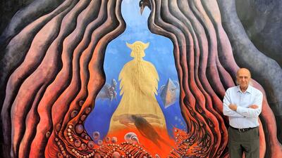 Iraqi artist Ala Bashir with one of his paintings. Photo: Ala Bashir