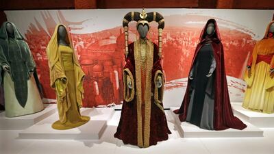 The Senate gown of Queen Amidala, centre, is seen with handmaiden gowns on display as part of an exhibit on the costumes of Star Wars at Seattle’s EMP Museum. The creators of the new exhibit, with 60 original costumes from the six Star Wars movies, are hoping to gather geeks, fashionistas and movie fans together to discuss how clothing helps set the scene. AP