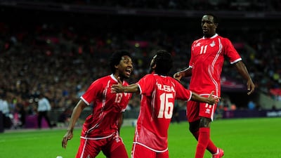 Rashed Eisa celebrates with teammates after scoring an equalising goal. Getty Images