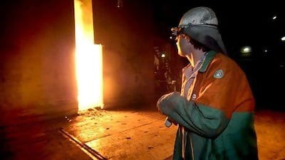 A steel worker monitors molten steel at the Corus factory in Ijmuiden, The Netherlands, Thursday, June 2, 2005. Photographer:Paul O'Driscoll/Bloomberg News.