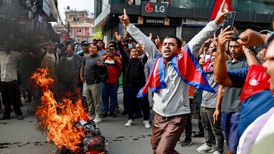 Demonstrators in Kathmandu burn tyres during a rally after the killings. The anti-corruption protests were triggered by a social media ban which was later lifted. AFP
