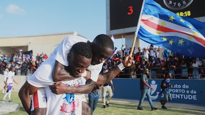 Cape Verde's Stopira, bottom, celebrates with his teammate after defeating Eswatini in a World Cup qualifying soccer match at Estádio Nacional in Praia, Cape Verde, Monday, Oct. 13, 2025, to clinch their qualification for the 2026 World Cup. (AP Photo / Cristiano Barbosa)