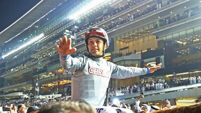 Victor Espinoza celebrates after riding California Chrome to victory in the Dubai World Cup Sponsored By Emirates Airline as part of the Dubai World Cup at Meydan Racecourse on March 26, 2016 in Dubai, United Arab Emirates. (Photo by Warren Little/Getty Images)