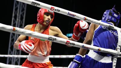 Raveen Raveen (in red) defeated Ali Hassan Sumon in the Asian Boxing Confederation’s Asian Junior Championships held at ADNEC Centre in Al Ain. Pawan Singh / The National