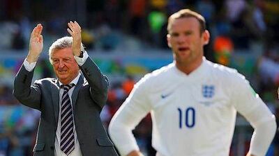 England's coach Roy Hodgson, left, applauds next to Wayne Rooney at the end of their 2014 World Cup Group D soccer match against Costa Rica at the Mineirao stadium in Belo Horizonte June 24, 2014. REUTERS/Damir Sagolj