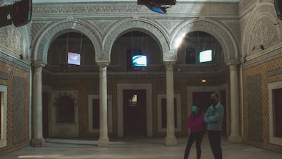 Oussama Menchaoui's 'Seeing Through Sounds' consists of six discarded TV sets, their innards exposed, are suspended in the middle of the darkened courtyard. Courtesy Nizar Messaoud