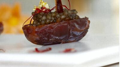 Caviar aux dattes at Beluga restaurant is an entree of medjool dates stuffed with caviar and garnished with saffron.