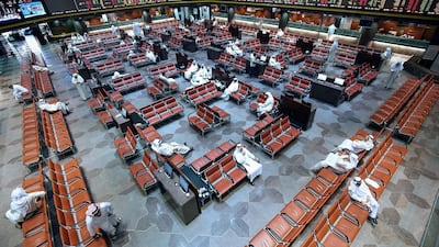 Kuwaiti traders in the main hall at the Kuwait Stock Exchange (Boursa) headquarters in Kuwait City. Middle East funds plan to target Kuwaiti stocks more. Yasser Al Zayyat / AFP
