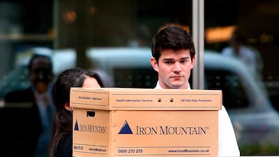 An employee outside the Lehman Brothers London offices with the contents of his desk in a box on September 15, 2008. So how has the financial community moved on from that moment? Photo: EPA