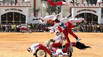 The Indian military's ASC Tornadoes daredevil bike team performs in Bangalore during India's 69th Republic Day celebrations on January 26, 2018. Republic Day marks India's adoption of its constitution after independence from British rule. Jagadeesh NV / EPA