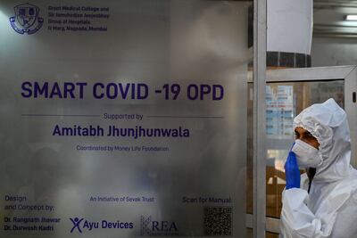 A health worker takes part in a mock drill to prepare for Covid-19 patients at a hospital in Mumbai. AFP