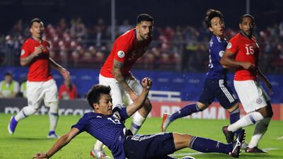 Takefusa Kubo , centre, misses a chance near the end of the match. EPA