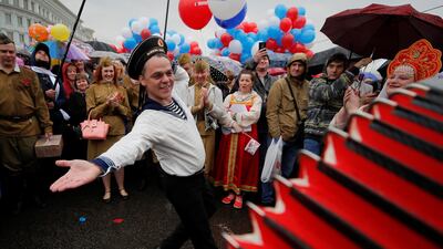 A man wearing a navy uniform performs before a May Day rally in central Moscow, Russia. Maxim Shemetov / Reuters