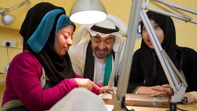 Sheikh Mohammed bin Zayed visits a jewellery workshop class while touring the Zayed Higher Organisation for Humanitarian Care and Special Needs facility in Al Mafraq. (Ryan Carter / Crown Prince Court - Abu Dhabi)