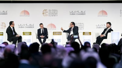Moderator Axel Threlfall, left, Editor At Large at Reuters, Dr Adnan Chilwan, Group chief executive of Dubai Islamic Bank, Azmi Omar, Director General of IRTI, and Hassan Al Damluji, Head of Middle East Relations of Bill and Melinda Gates, speak at the third plenary Session of the Global Islamic Economy Summit 2016, “Is blended finance the solution to the funding requirements of sustainable development goals?” Reem Mohammed / The National