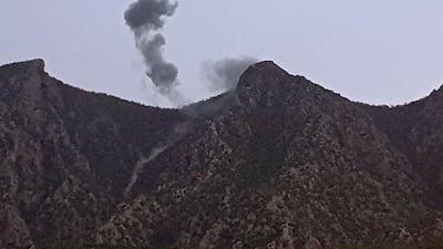 Smoke billows from behind mountains in Chiladze after a Turkish offensive against rebels in the Iraq's autonomous Kurdistan region in April last year. AFP