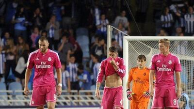 Real Madrid's Karim Benzema, left, Sergio Ramos, second left, Iker Casillas, second right, and Toni Kroos, right, react after conceding Real Sociedad's fourth goal in their 4-2 loss on Sunday in La Liga. Ander Gillenea / AFP / August 31, 2014