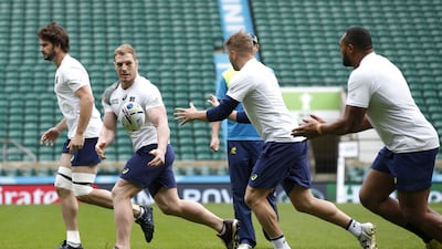 Australia’s David Pocock, second from left, trains with teammates at Twickenham ahead of Saturday’s Rugby World Cup final. Paul Childs / Reuters