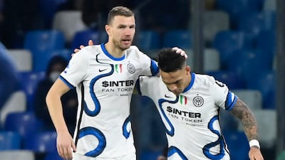Inter Milan's Edin Dzeko celebrates his goal with teammate Lautaro Martinez. AFP