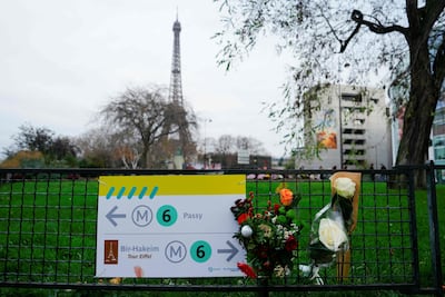 Flowers at the spot where a tourist was stabbed to death near the Eiffel Tower in Paris. AFP