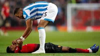 Manchester United's Marcus Rashford and Huddersfield Town's Mathias Jorgensen. Reuters