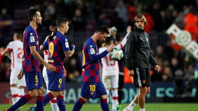 Barcelona's Lionel Messi with the matchball after the match. Reuters