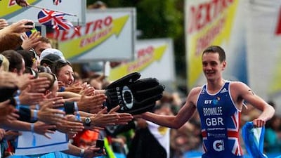 Alistair Brownlee took a victory jog after winning the men's London Triathlon by 25 seconds.