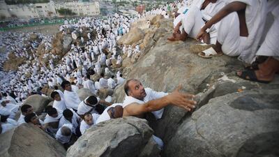 Pilgrims climb Mount Mercy on the plains of Arafat during the peak of the annual Haj pilgrimage, near the holy city of Mecca. Ibraheem Abu Mustafa / Reuters